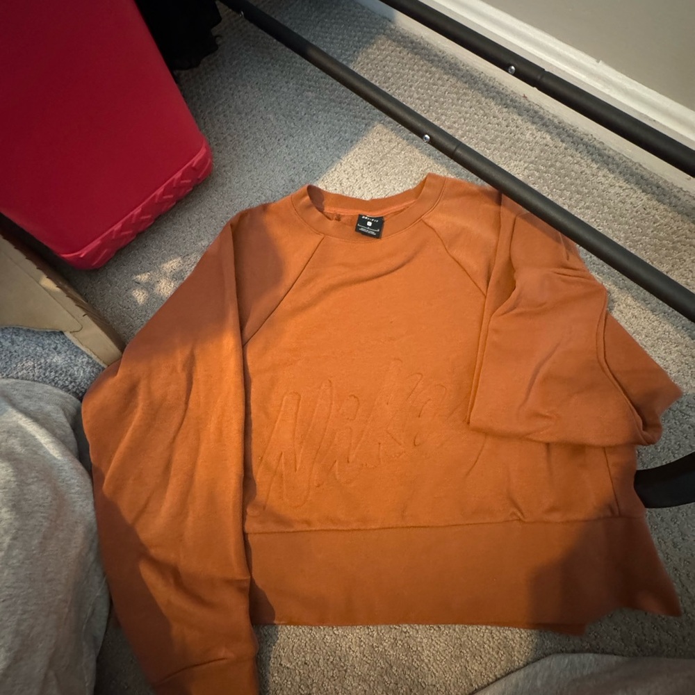 Nike woman’s burnt orange cropped sweatshirt